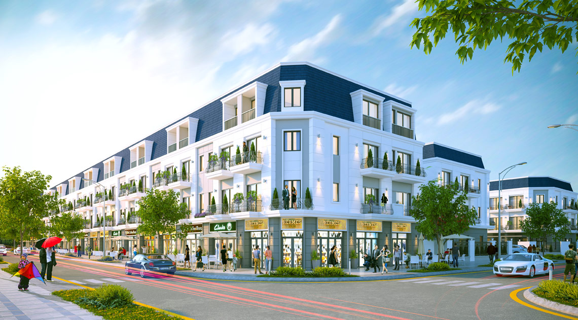 Hình ảnh khu nhà phố hiện đại với mặt tiền thương mại, cây xanh và hạ tầng đồng bộ – minh họa cho khu vực tiềm năng khi chọn mua đất xây nhà.