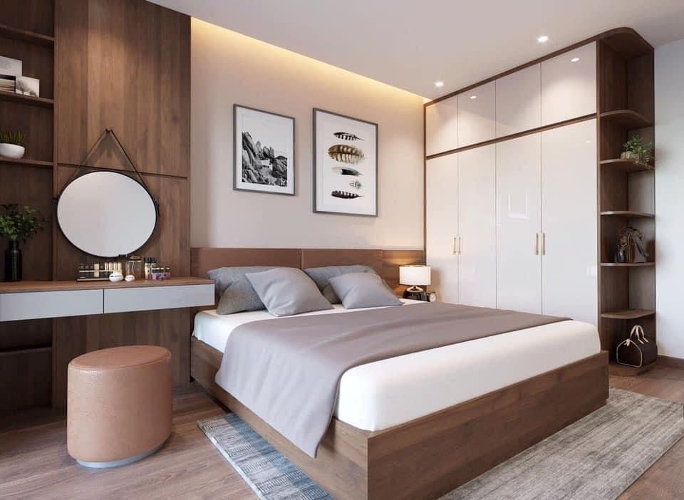 Thiết Kế Nhà Phố Tiện Nghi: 2 Tầng, Có Gara, Tối Ưu Diện Tích Phòng ngủ nhà phố tiện nghi với nội thất gỗ hiện đại, tủ quần áo âm tường và bàn trang điểm